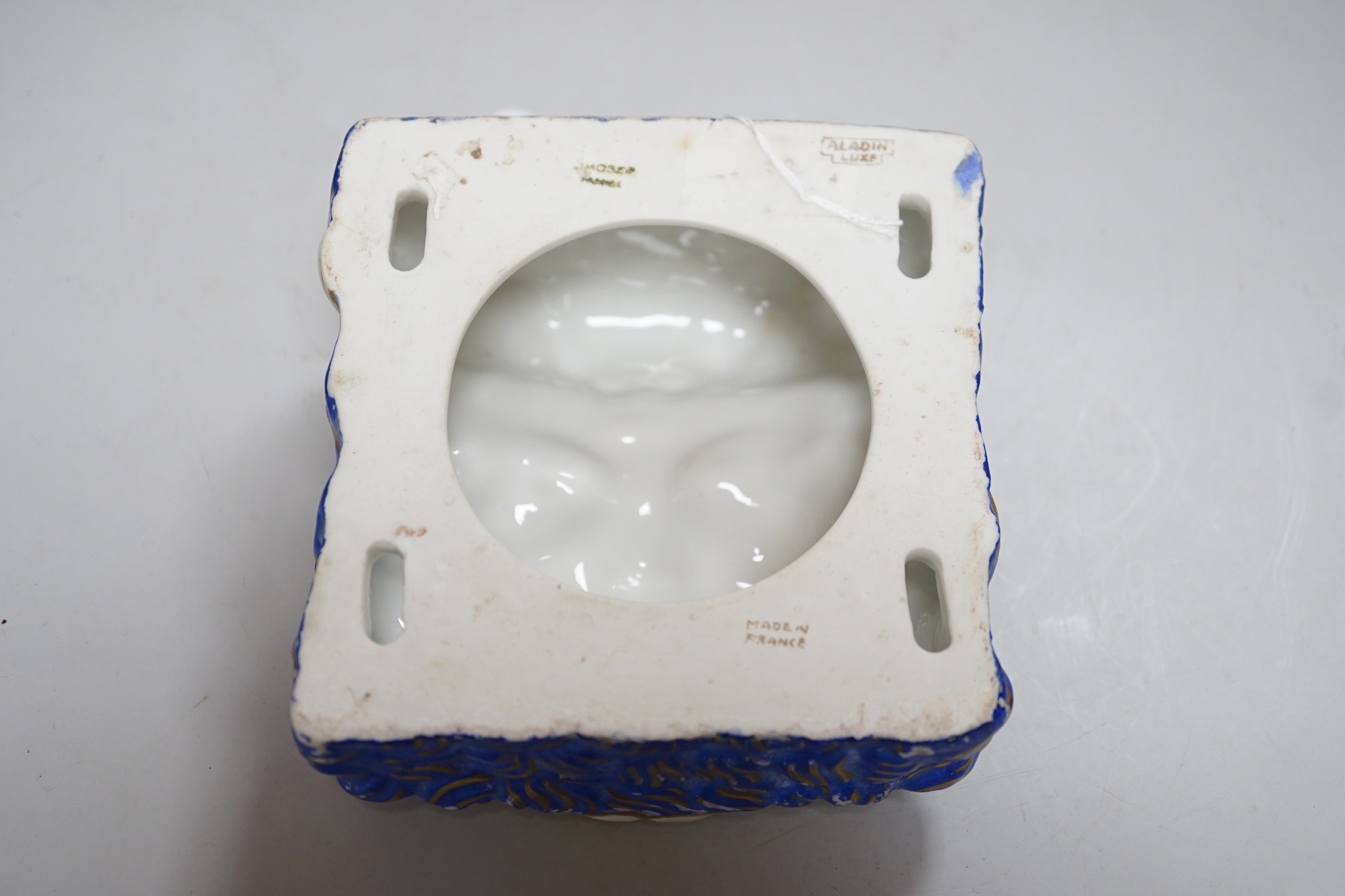 A French Art Deco wall face mask, made by Aladdin Luxe. 14cm tall
